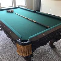 Charles A Porter Renaissance Pool Table, several cue sticks incl Ray Schuller, pub table & stools